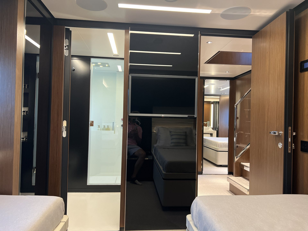 Below deck - Twin cabin facing bathroom and lobby.webp